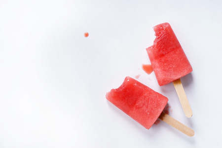 Homemade watermelon popsicles on white marble backgroundの写真素材