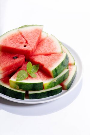 Slices of fresh watermelon on white marble backgroundの写真素材