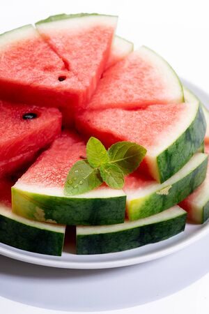 Slices of fresh watermelon on white marble backgroundの写真素材