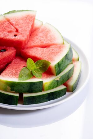 Slices of fresh watermelon on white marble backgroundの写真素材