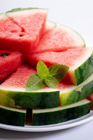 Slices of fresh watermelon on white marble backgroundの写真素材