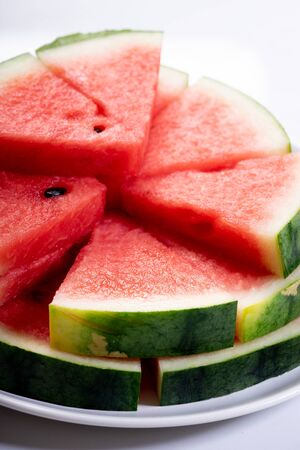Slices of fresh watermelon on white marble backgroundの写真素材