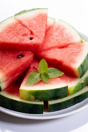 Slices of fresh watermelon on white marble backgroundの写真素材
