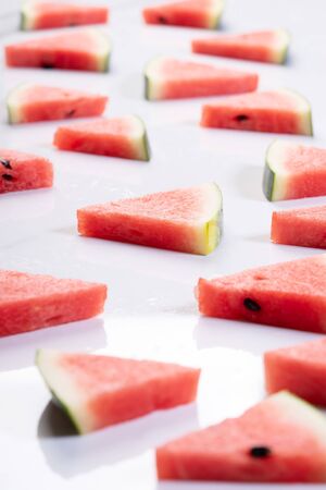 Slices of fresh watermelon on white marble backgroundの写真素材