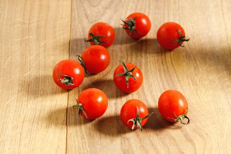 red cherry tomato on wooden backgroundの写真素材