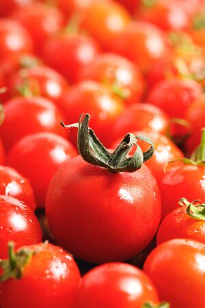red cherry tomatoes on wooden backgroundの写真素材
