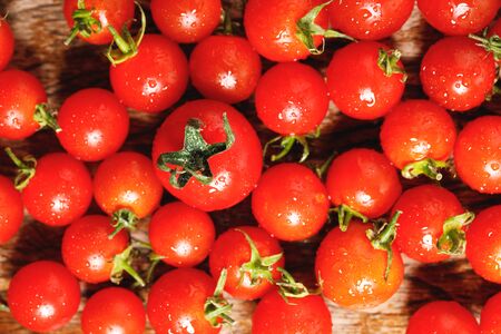 red cherry tomatoes on wooden backgroundの写真素材
