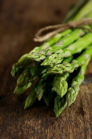 Asparagus,  Fresh Asparagus on white background  Fresh Asparagus on wooden backgroundの写真素材