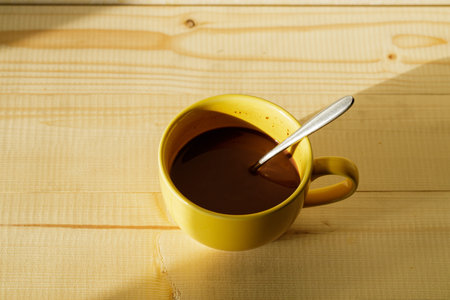 A cup of hot chocolate on wooden background.の写真素材