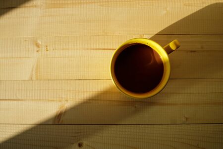 A cup of hot chocolate on wooden background.の写真素材