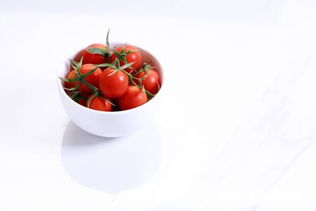 red cherry tomato on white marbel backgroundの写真素材