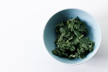 Fresh green Kale leaf salad vegetable on white backgroundの写真素材