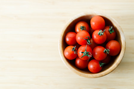 red cherry tomato on wooden backgroundの写真素材