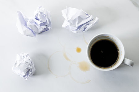 Cup of black coffee on white marble background. Working concept. Selective focus. Copy space. Flat lay. Top view.の写真素材