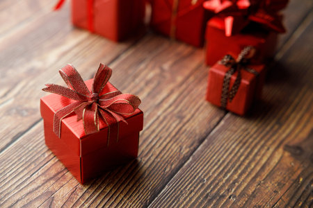 Assorted artisanal gift boxes on wooden background. Christmas New year concept. Selective focus.