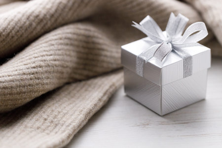 Artisanal gift boxes on warm sweater. Christmas New year concept. Selective focus.