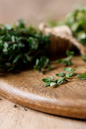 Fresh green organic Thyme on rustic wooden background. Selective focus.の写真素材