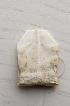 tea bag blended from rooibos, spearmint, apple, baobab on white wooden table. selective focus.の写真素材
