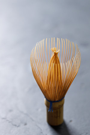 Closeup of Chasen or Bamboo whisk, an equipment for preparing matcha green tea. Selective focus.の写真素材