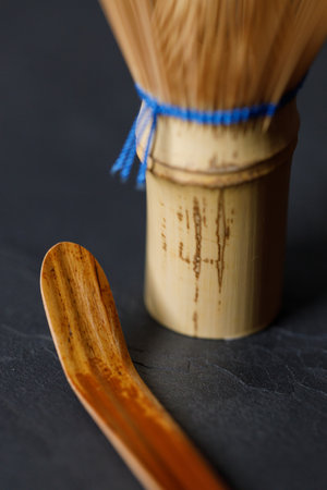 Closeup of Chasen or Bamboo whisk and Chashaku or tea scoop, equipments for preparing matcha green tea. Selective focus.の写真素材