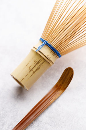 Closeup of Chasen or Bamboo whisk and Chashaku or tea scoop, equipments for preparing matcha green tea. Selective focus.の写真素材