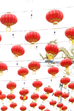Lunar or Chinese new year lanterns decorated against dragon shape lamp post, Thailand.
