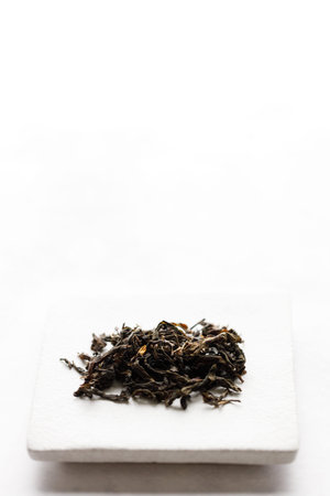 Japanese or Chinese tea leaf on white background. selective focus.