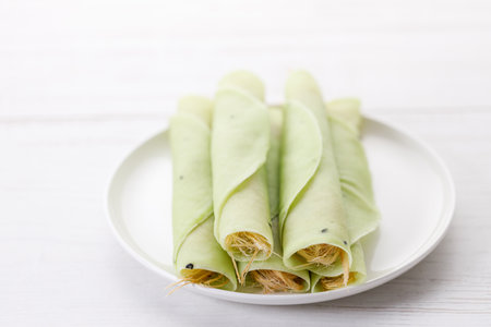 Roti Sai Mai, Dessert from Thailand served by wrapping cotton candy in sweet Roti or round flatbread.  Indian Muslim influenced dessert. Selective focus.の写真素材