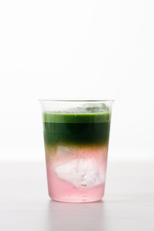 fresh matcha tea, green tea and coconut water on white wooden background. Selective focus.