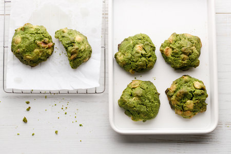 Closeup of fresh baked matcha cookies on white wooden background. Selective focus.の写真素材