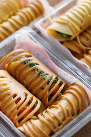 Stack of pancake roll filled with assorted filling. Selective focus.の写真素材