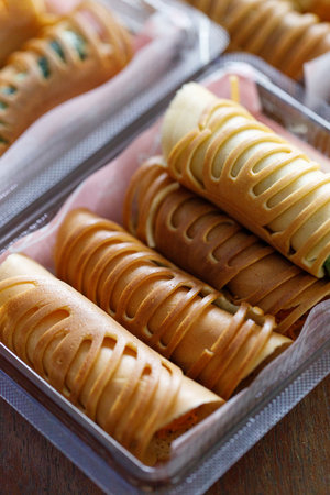 Stack of pancake roll filled with assorted filling. Selective focus.の写真素材