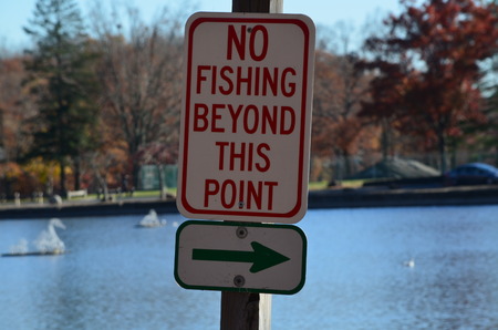 A no fishing sign in a parkの写真素材