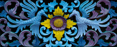 Close up blue and yellow painted wood carved door backdrop and wallpaper textureの写真素材