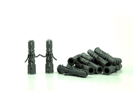 Old dowels on an isolated white background. The concept and idea of a dowel in the form of people...