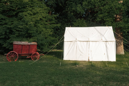 Military tents for spending the night soldiers. Military medieval camp with tents and weaponsの写真素材