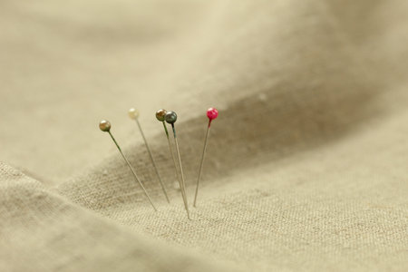 Pins with a round head in different colors, for pattern and sewing. Background with place for text. Close-upの写真素材