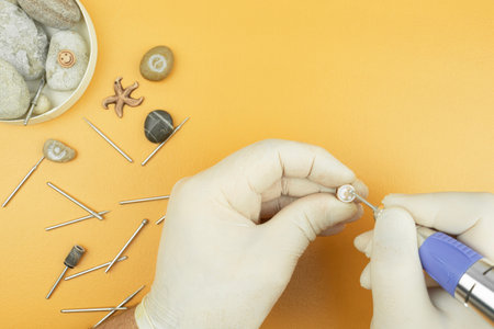 The process of stone processing, handmade products, the process of production of souvenir products. Copy space. Creative workshop with works of artの写真素材
