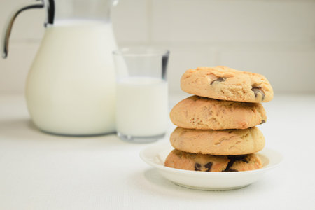 Homemade chocolate chip cookies, Cookies and a jug of milk. Preparation of homemade cookies, baking....