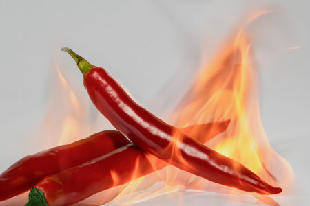 Red hot paprika. Hot red pepper, burning like fire. Food photo concept. Creative