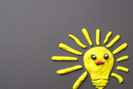 Concept idea. A yellow bulb with a bright beam. Background with place for text. Illustration, Copy spaceの素材
