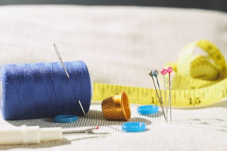 Needle thread, side view. Copy space. Background for creators. Sewing fittings. Side view, close up, selective focusの写真素材