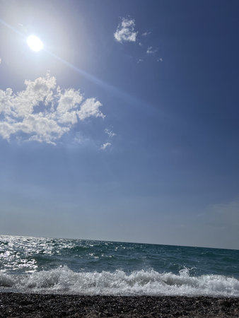 beautiful seascape with sea waves and blue sky with cloudsの写真素材