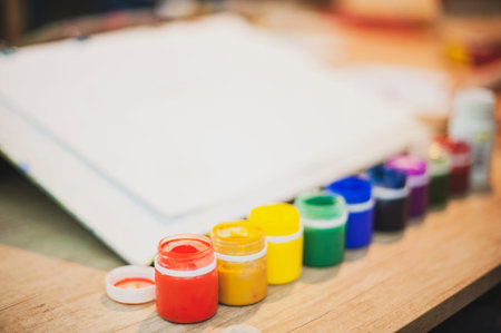 a sheet of paper and bright colors are on the table