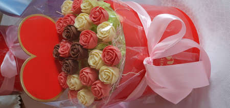 Bouquet of chocolate flowers, chocolate roses. Holiday concept, holiday gift. Place for your text.の写真素材
