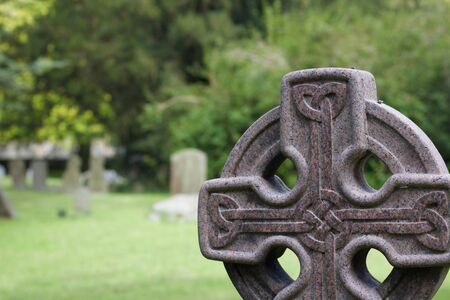 Gravestone in cemetary with celtic knot designの写真素材