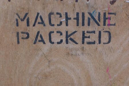 Machine packed stencilled on wooden boxの写真素材