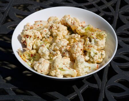 A bowl of cauliflower on a plate. High quality photoの写真素材