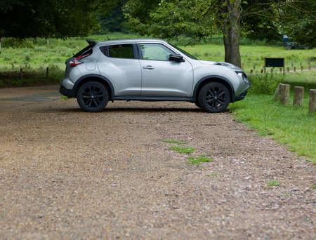 4 July 2020 - England, UK: Nissan Juke parked in countryside with copy spaceのeditorial素材