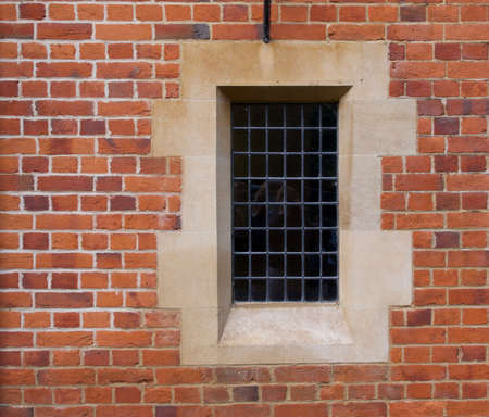 Architectural feature showing old fashioned window embedded in brick wallの写真素材